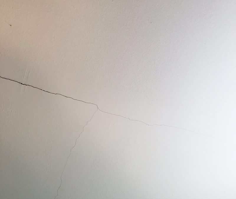 Drywall ceiling crack, a potential sign of foundation or water problems in home